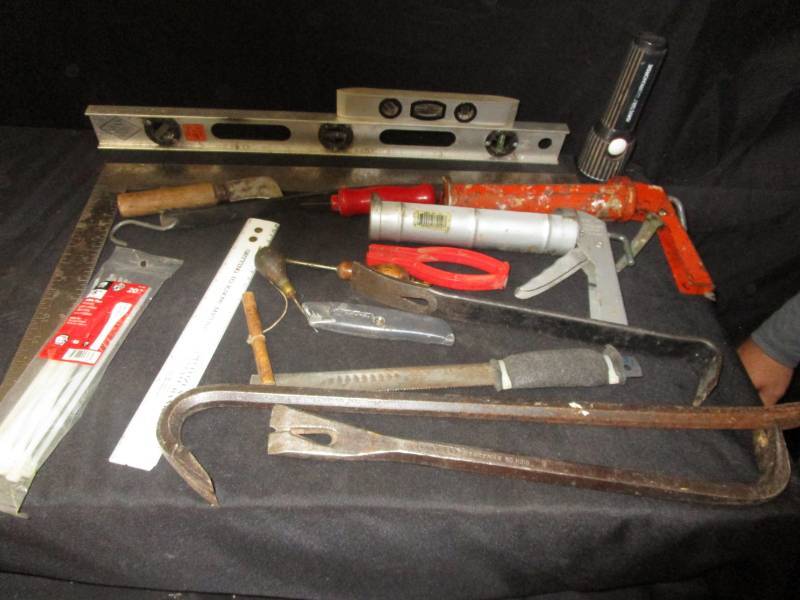 lot 37 image: Calking guns, wrecking bars, flashlight works, zip ties square, levels, and Stanley crow bar