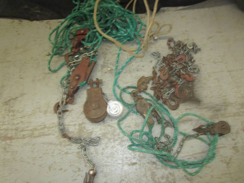 lot 91 image: Various block and tackles with rope and vintage steel pulley