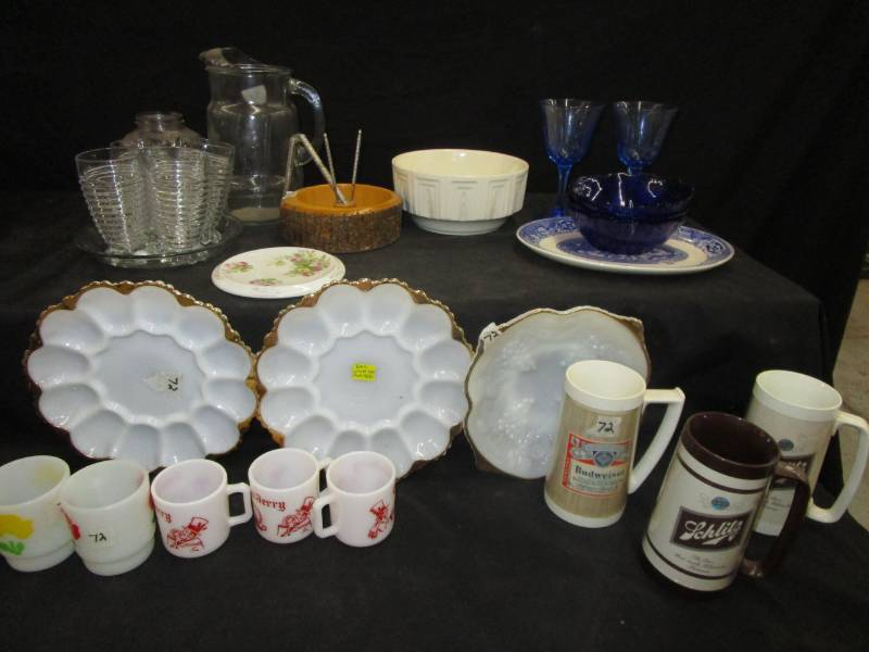 lot 117 image: Glass serving trays, Haeger dish USA, old Crisco jar, Blue glass bowls, Schlitz and Budwieser plastic mugs and Tom and Jerry mugs