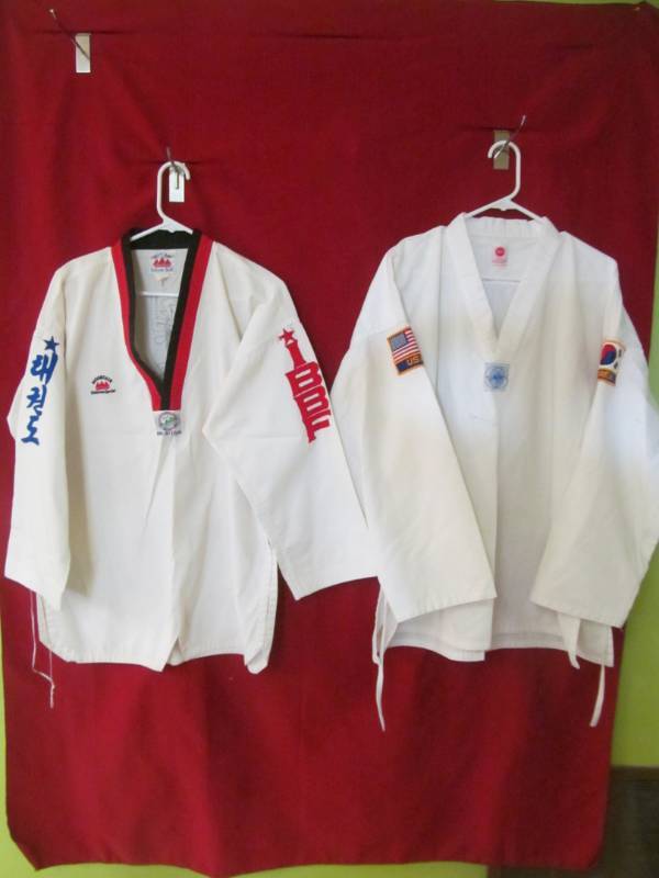 lot 127 image: Martial Arts uniforms (size 5, 2 tops and 2 bottoms)