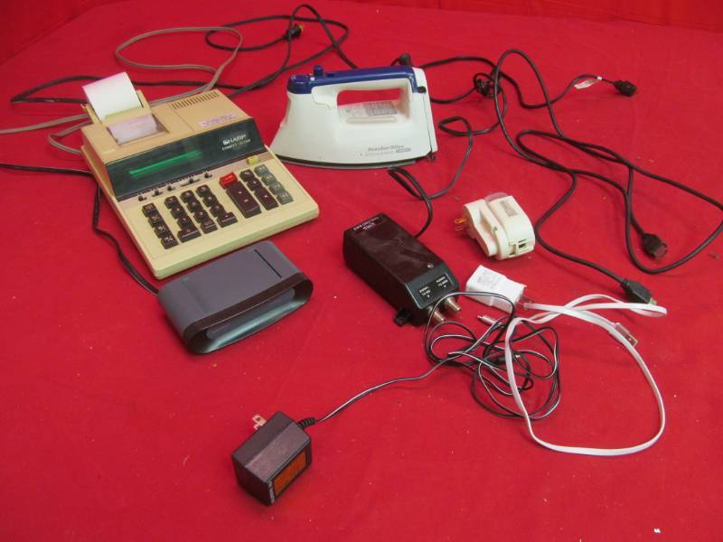lot 150 image: Sharp calculator, Proctor Silex Iron, RF Modular, power inserter, glade plug-in