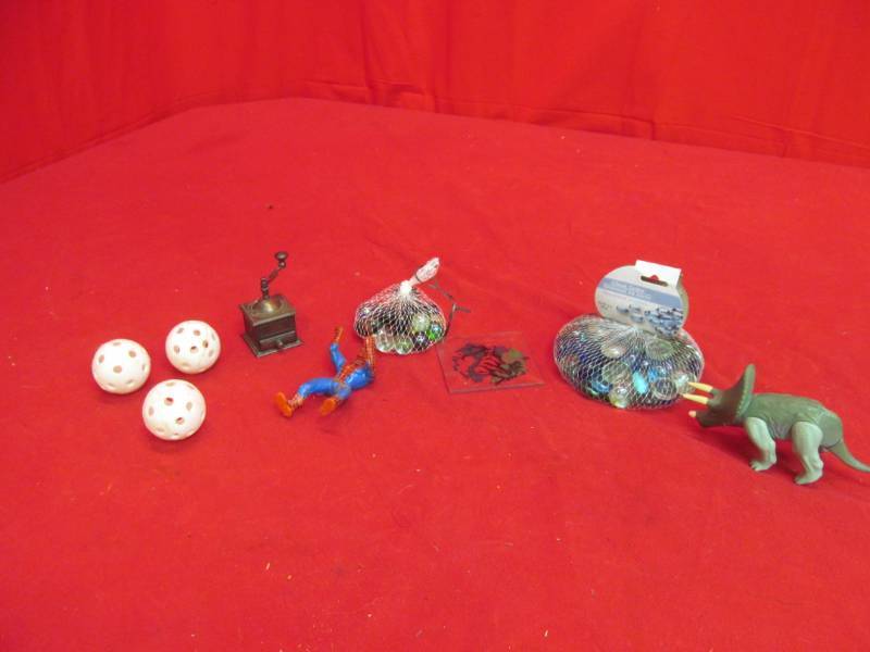 lot 194 image: vintage pencil sharpener, marbles, Spiderman, dinosaurs, balls