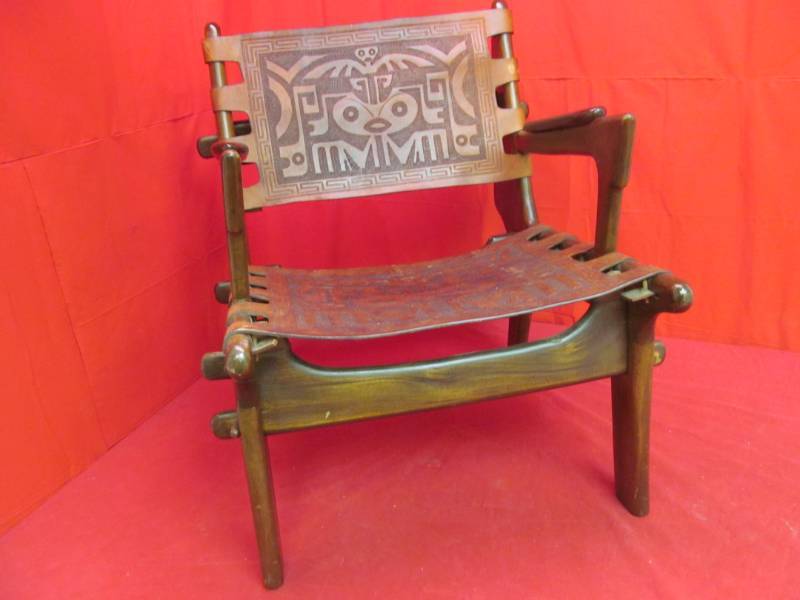lot 222 image: Wooden chair with leather Aztec design