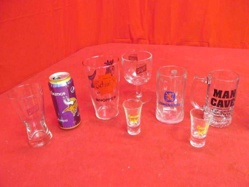 lot 291 image: 2 Schlitz, Lowenbrau mug, man cave, Timberwolves glass, Vikings Pepsi can, 2 Galliano hot shot glasses, Schmidt glass