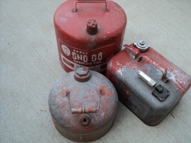 3 metal gas cans...