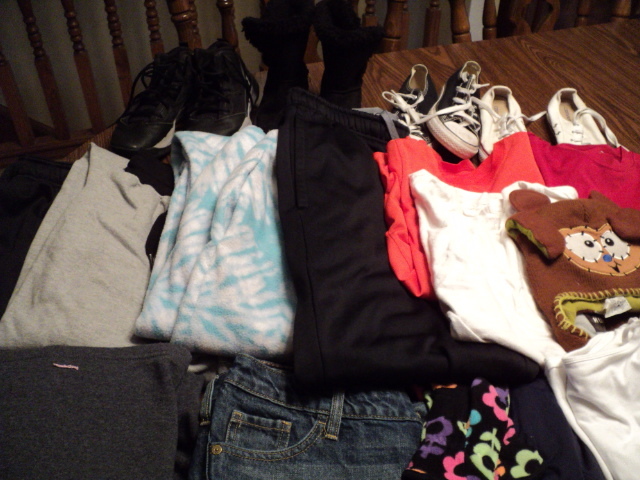 variety of shoes and clothing, most...