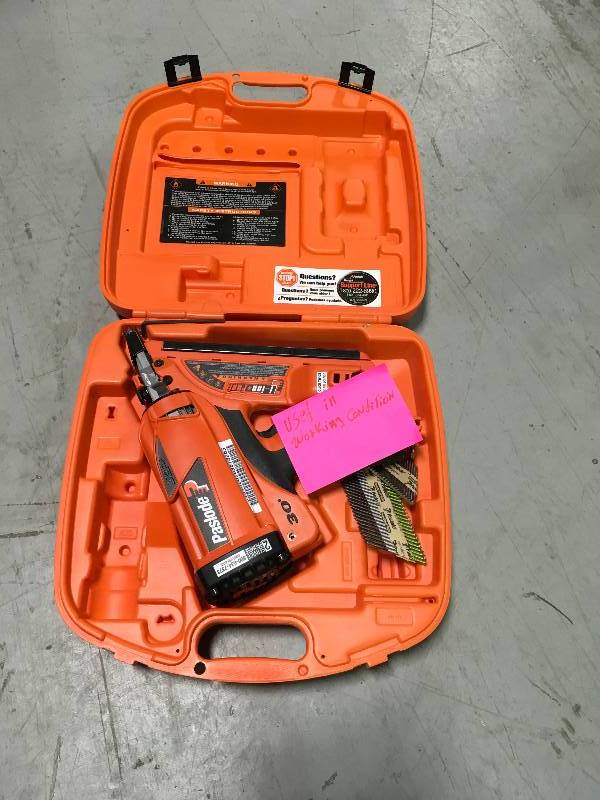 lot 24 image: PASLODE XP NAILER 30 WITH EXTRAS  unknown conditions