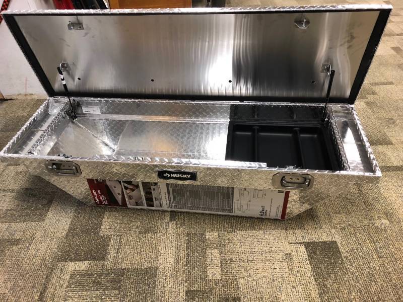 lot 107 image: Husky Truck Boxes 62 in. Aluminum Polished Mid Sized Low Profile Truck Box not used