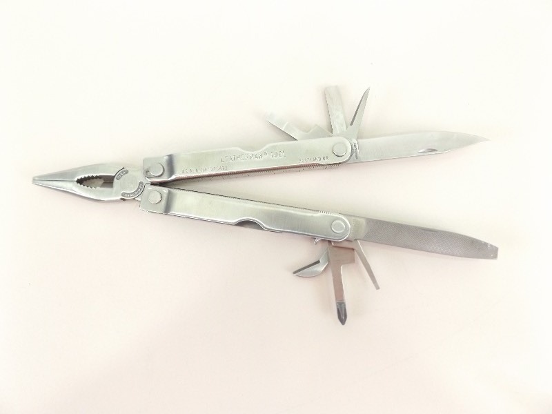 lot 28 image: Vintage 1st Edition Leatherman Multitool in Leather Case