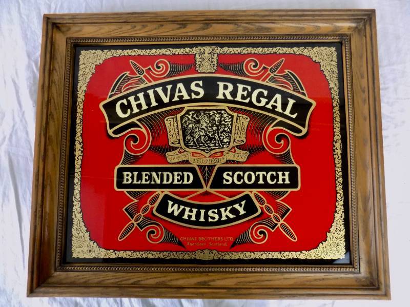 lot 11 image: 4 Pieces - Chivas Regal Dimensional Sign  Vintage Budweiser Igloo Cooler  Vintage Coors Light Super Cooler  Hooters Can Koozie