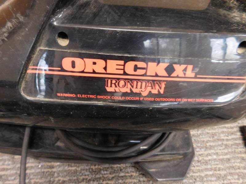 lot 36 image: Oreck XL Ironman Handheld Vacuum Cleaner with Attachments
