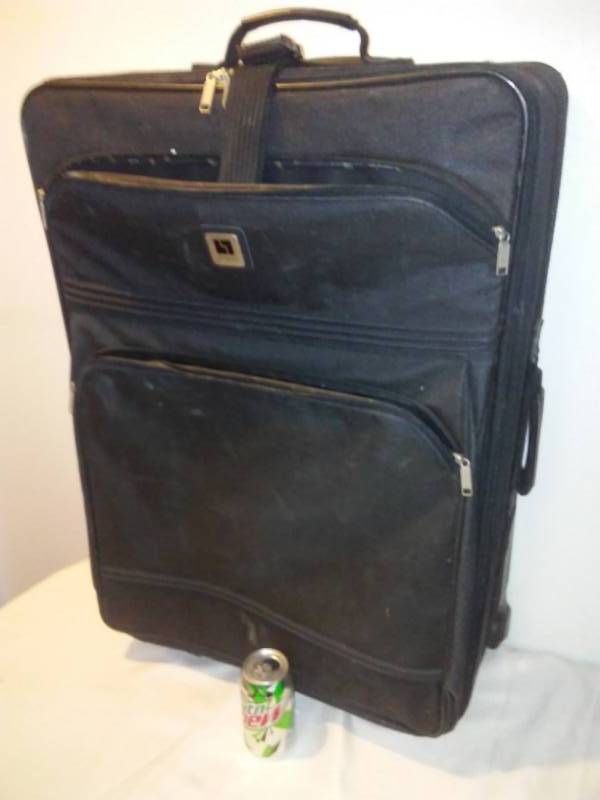 lot 35 image: Suit case huge and clean.