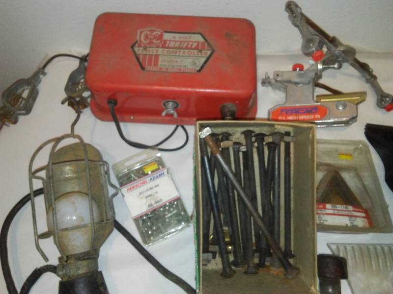 lot 58 image: Man stuff - floor mats, 6 volt electric fencer, gas shut off valve & More.