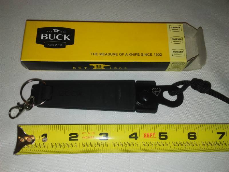 lot 63 image: Buck knife with case and belt clip.
