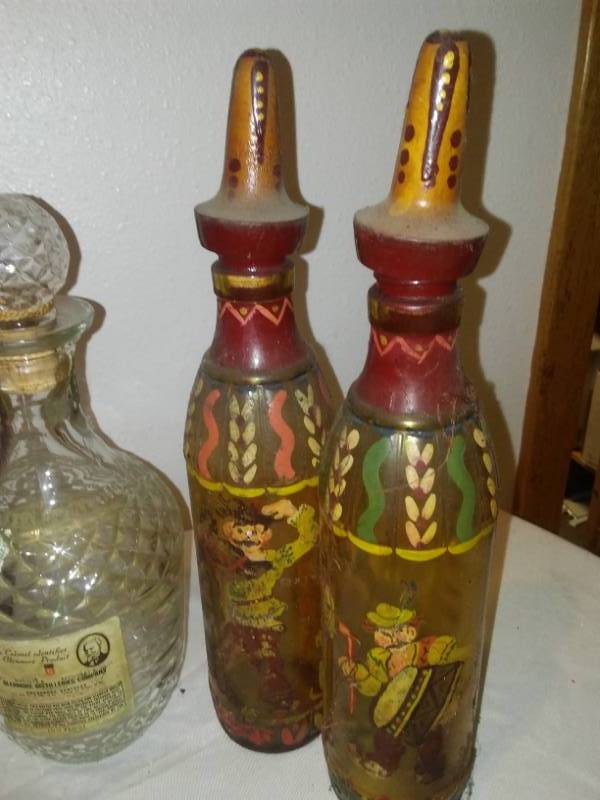 lot 84 image: Decorator decanters and Bottles - 12 and all. Great for Halloween potions.