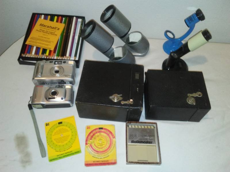lot 85 image: Photography accessories and cameras.