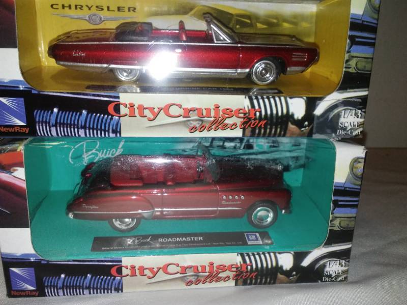 lot 106 image: 2 cars, 64 Chrysler turbine and Buick Roadmaster.