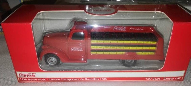 lot 113 image: 4 cars, Coke truck,  Studebakers.