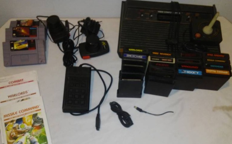 lot 130 image: Atari 2600 game console, games and more.