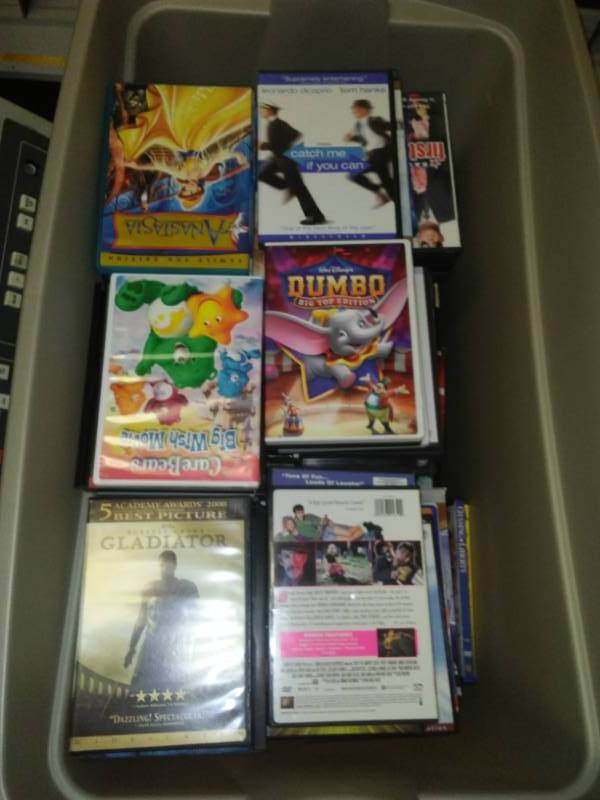 lot 133 image: Dozens of empty DVD cases and tote