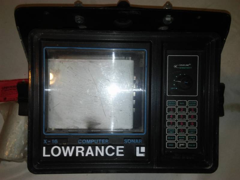 lot 138 image: Lowrance F-16 fish locator and paper depth finder.