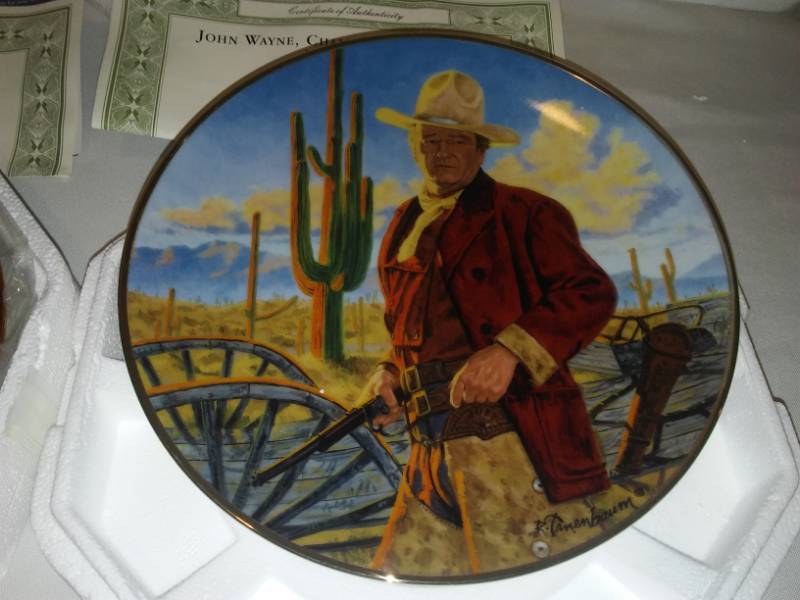 lot 165 image: 2 John Wayne plates. The legend lives on, Champion of the West.