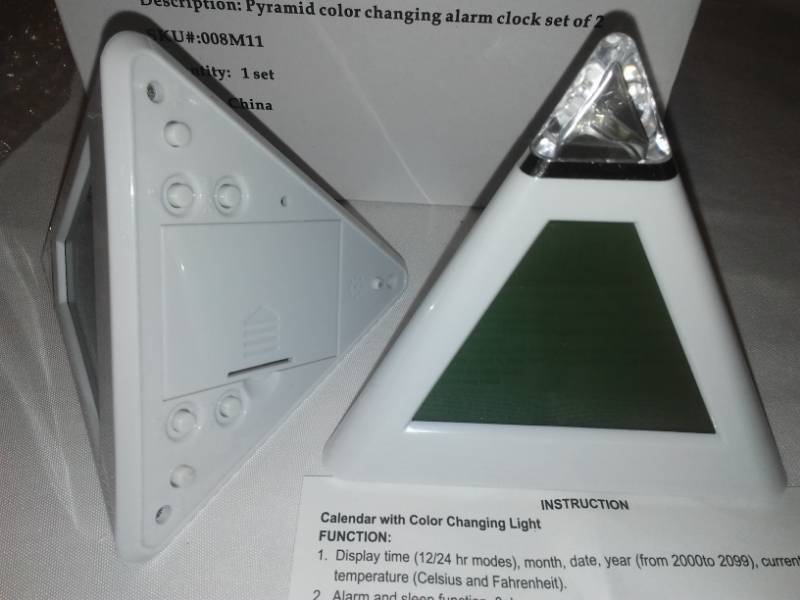 lot 171 image: 2 Pyramid color changing alarm clock. Set of 2. New in box.