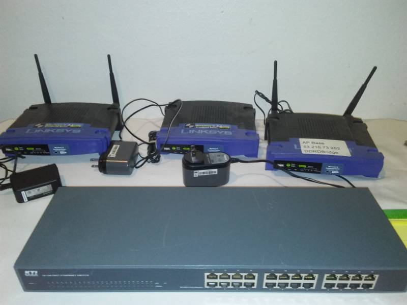 lot 175 image: 3 Linksys modems and KTI internet switch.