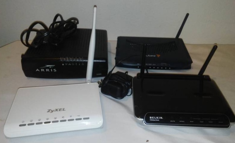 lot 178 image: 4 Modems, Belkin, Zyxel, UBee, Arris.