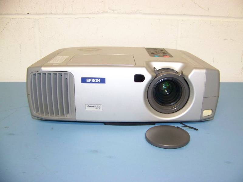 lot 17 image: Epson, PowerLite, LCD Projector with (5) NEW Digital Decoration Holiday  Celebration DVDs and (2) NEW Projection Materials (Window and Hologram)