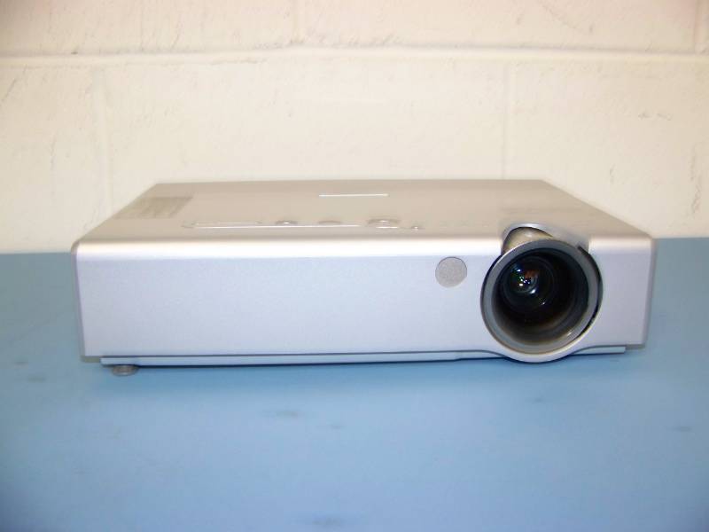 lot 18 image: Samsung, LCD Projector, (5) NEW Digital Decoration Holiday  Celebration DVDs and (2) NEW Projection Materials (Window and Hologram)