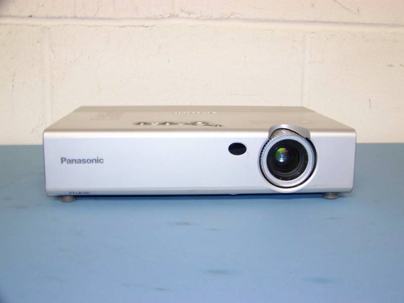 lot 20 image: Panasonic, LCD Projector, (3) NEW Digital Decoration Holiday  Celebration DVDs and (2) NEW Projection Materials (Window and Hologram)