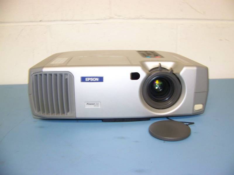 lot 21 image: Epson, PowerLite, LCD Projector with (3) NEW Digital Decoration Holiday  Celebration DVDs and (2) NEW Projection Materials (Window and Hologram)