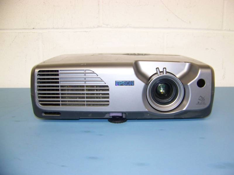 lot 22 image: Epson, PowerLite, LCD Projector with (3) NEW Digital Decoration Holiday  Celebration DVDs and (2) NEW Projection Materials (Window and Hologram)