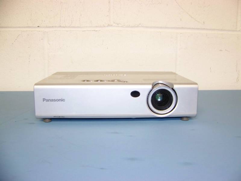 lot 25 image: Panasonic, LCD Projector, (3) NEW Digital Decoration Holiday  Celebration DVDs and (2) NEW Projection Materials (Window and Hologram)