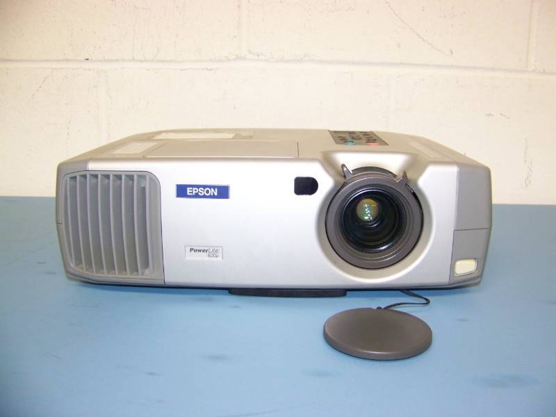 lot 23 image: Epson, PowerLite, LCD Projector with (3) NEW Digital Decoration Holiday  Celebration DVDs and (2) NEW Projection Materials (Window and Hologram)