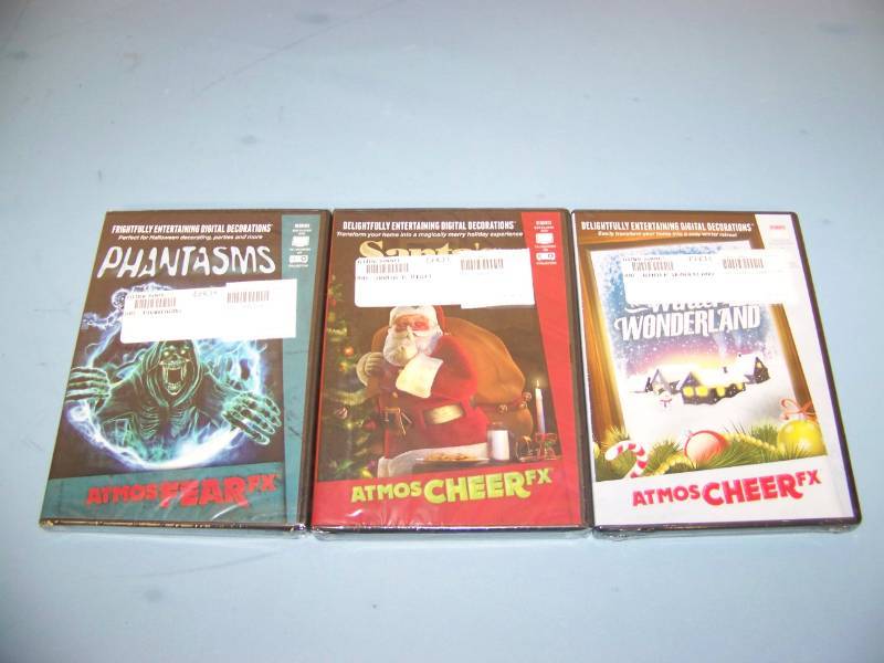 lot 27 image: (3) NEW Digital Decoration Holiday  Celebration DVDs and (2) NEW Projection Materials (Window and Hologram)