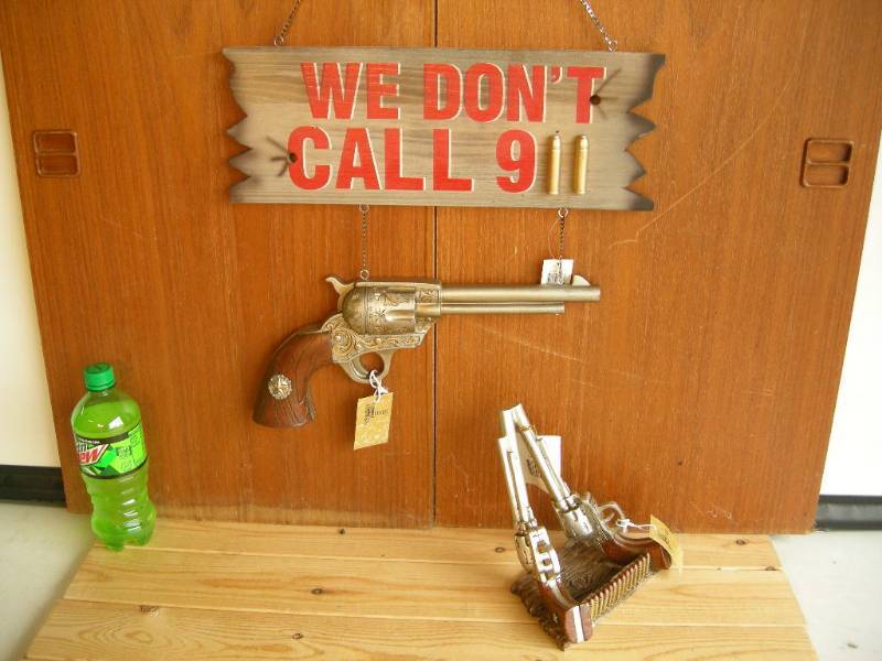 lot 41 image: Pistol Sign and Holder