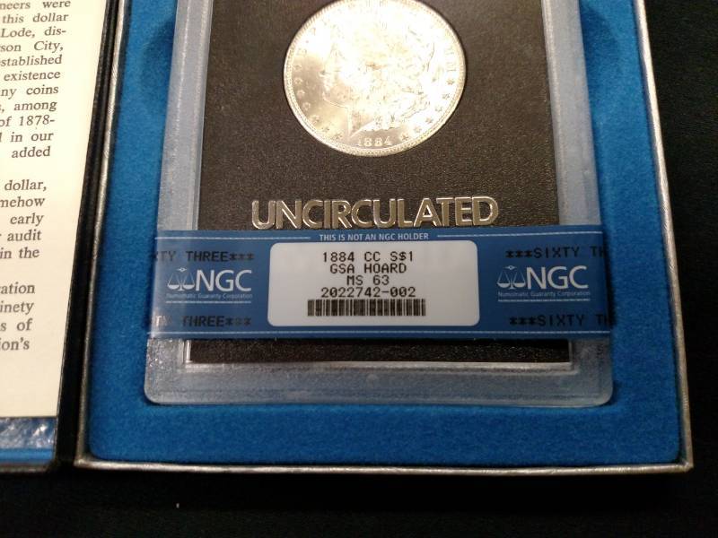 lot 5 image: 1884 CC GSA NGC MS63 Morgan Silver Doll...