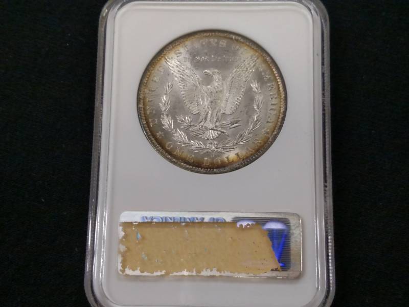 lot 12 image: 1885 O NGC MS63 Some Toning Morgan Silv...