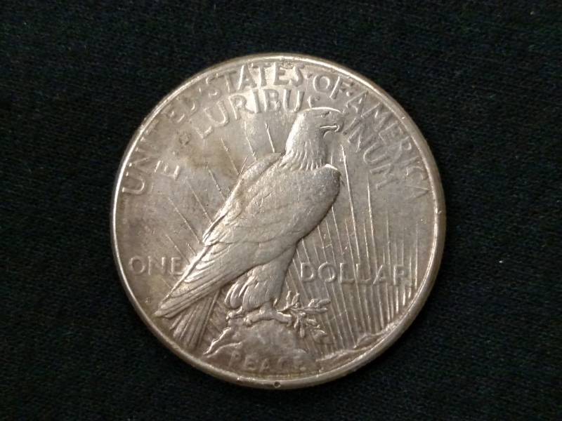 lot 24 image: 1923 S Peace Silver Dollar...