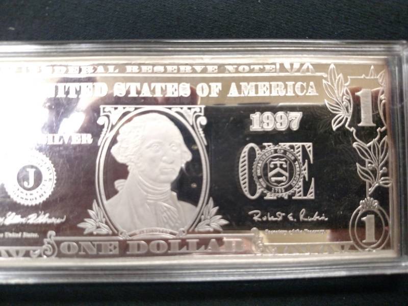 lot 37 image: 1997 Four Ounce .999 Silver Bar One...
