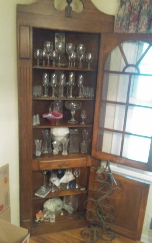 lot 35 image: Contents Of Corner Cabinet Goblets, Vases, Decanter, Misc Glassware, Includes Ornamental Iron Bottle Rack