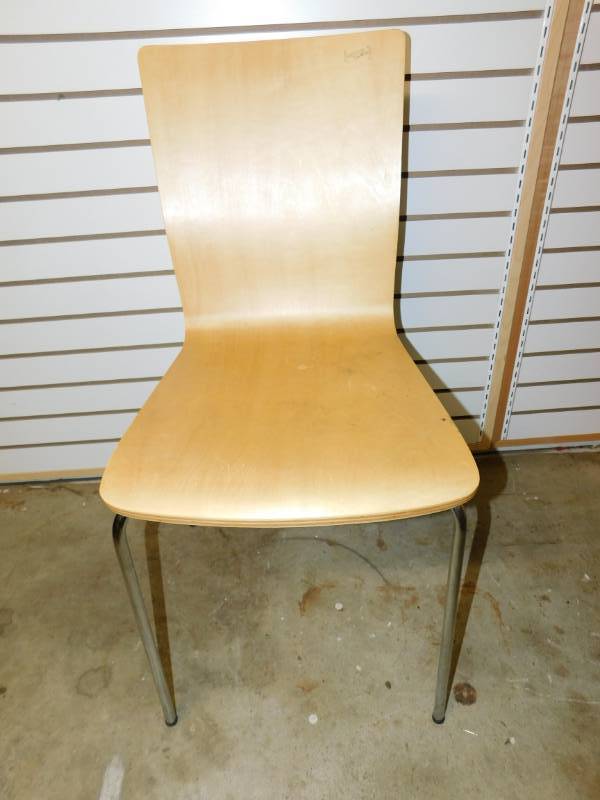 lot 37 image: Light Colored Chair With Stainless Steel Legs