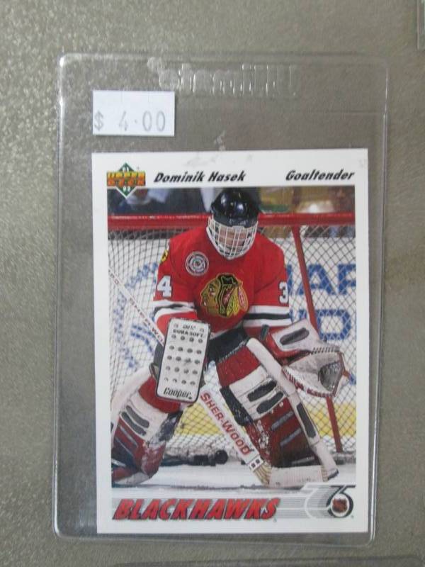 lot 38 image: Dominic Hasek Hockey Cards...