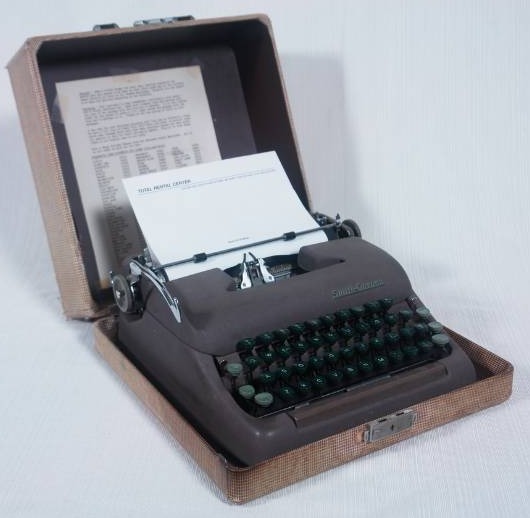 lot 66 image: Vintage Smith Corona Portable Typewriter with Case and Green Keys