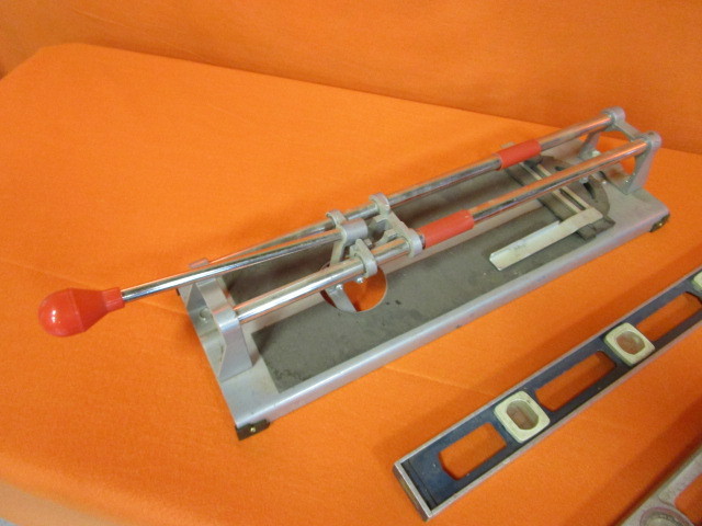 lot 45 image: Tile Cutter & (2) 2 Levels