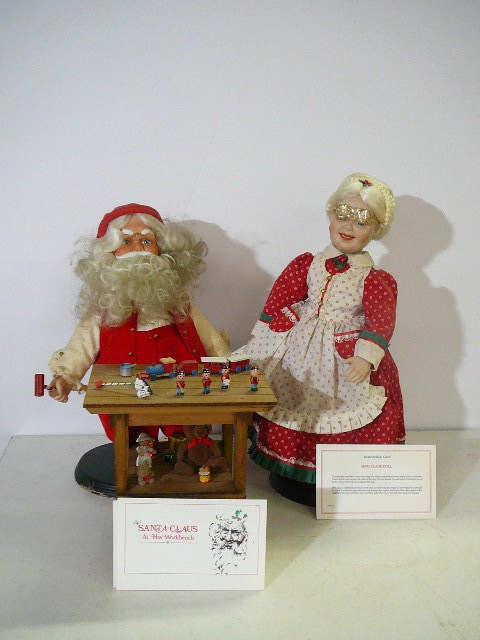 lot 81 image: Santa Claus at his workbench Mrs. Claus