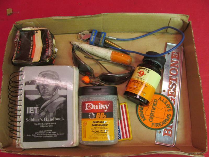 lot 48 image: gun cleaner, BBs, soldiers hand book, cable paddle lock with key