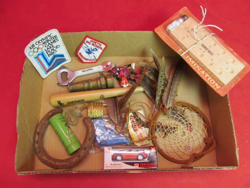 lot 49 image: Vintage toys, wind catcher, brass nozzle, baseball bat, authentic horse shoe
